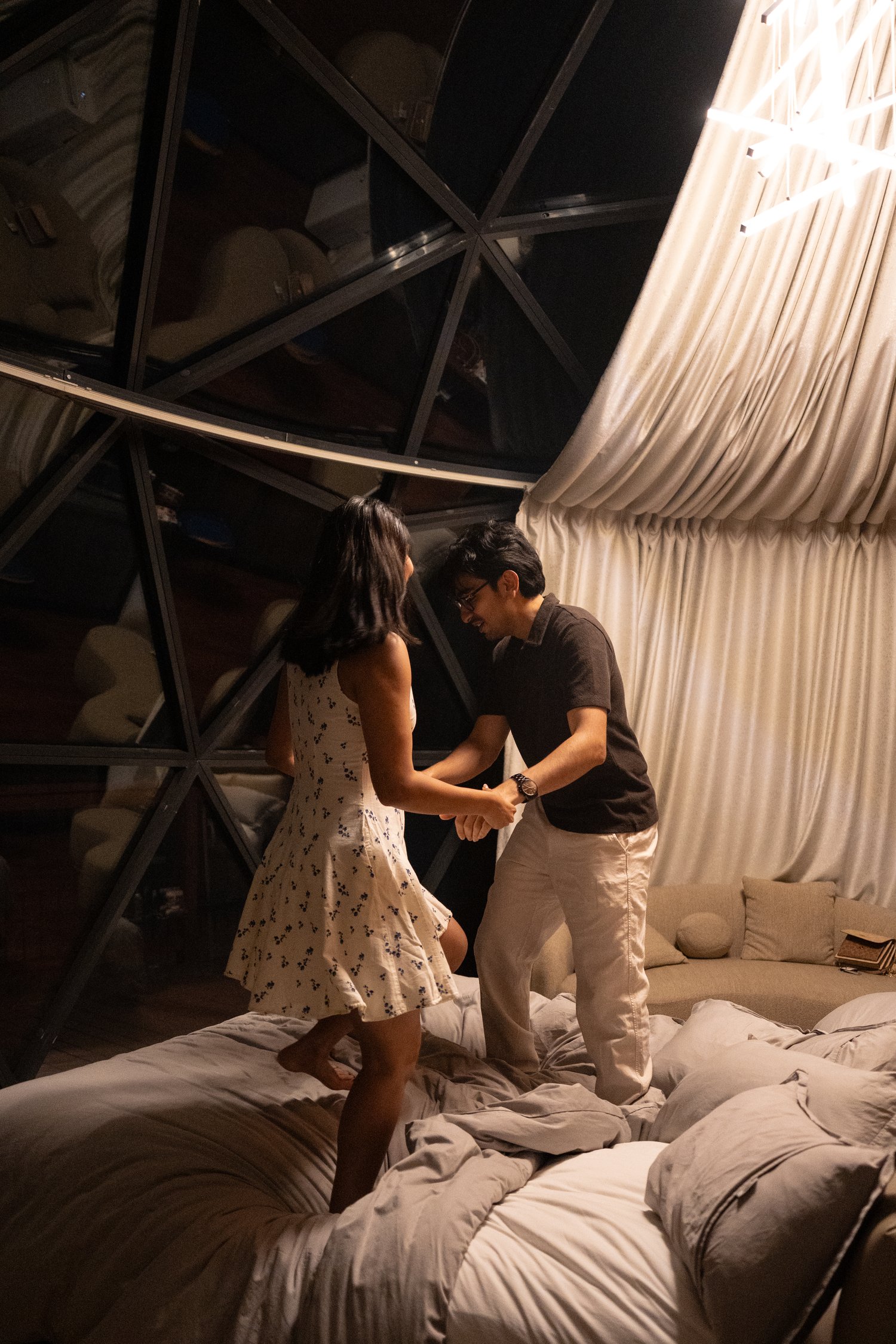 Couple dancing together inside their glamping dome before a surprise proposal at Bryce Canyon