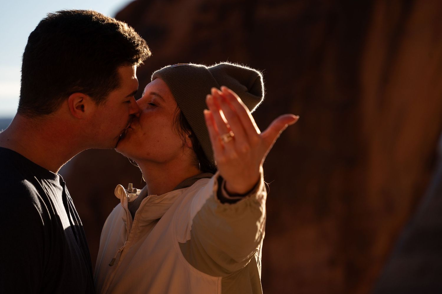 Couple sharing a romantic kiss after proposal