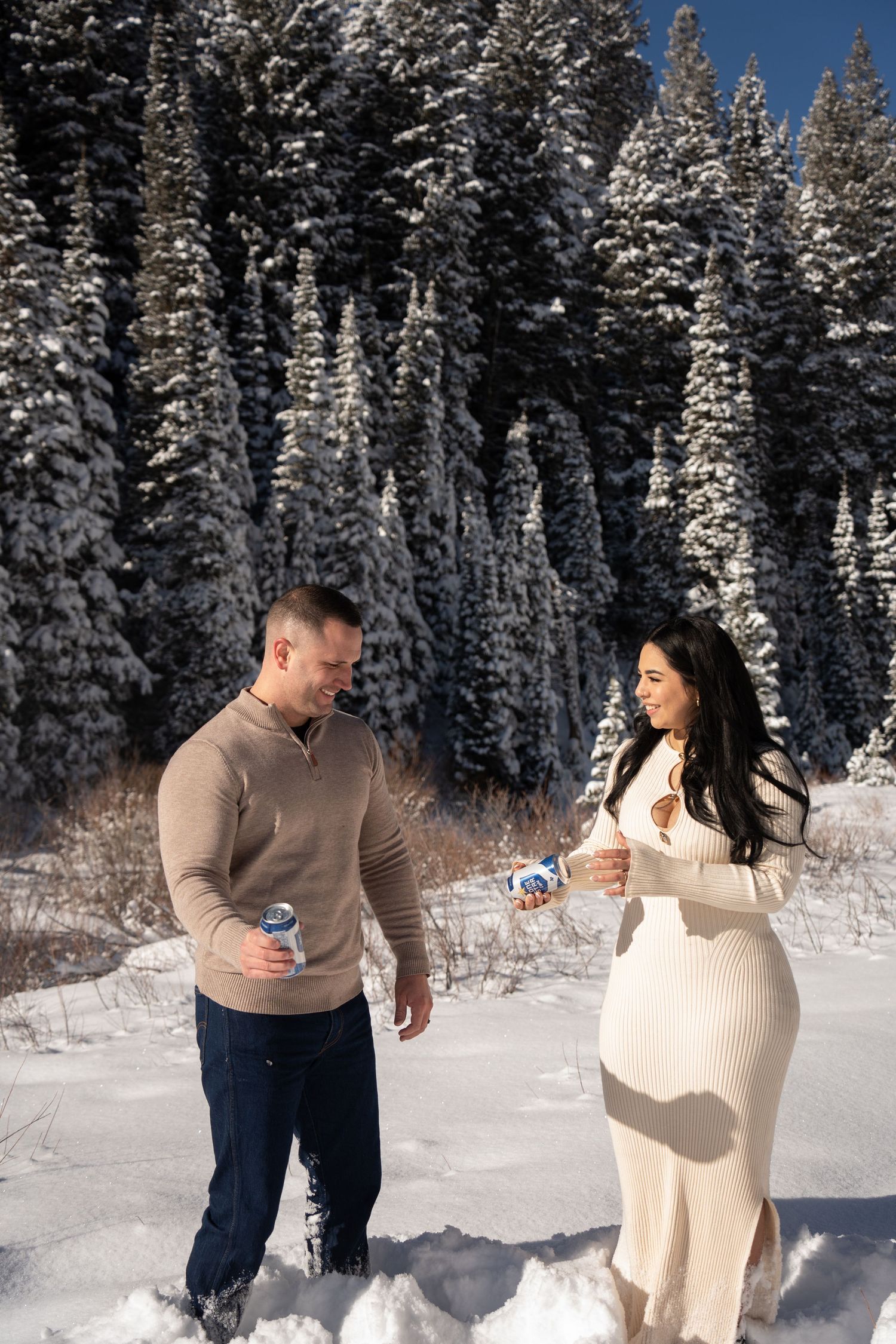 Couple celebrating with champagne in the snow after their Salt Lake City-area elopement