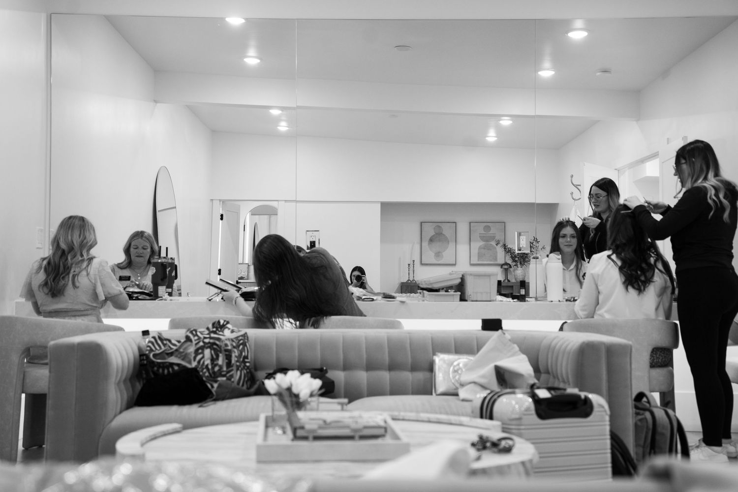 Black and white photo of a bride getting ready at the memories on main payson wedding venue