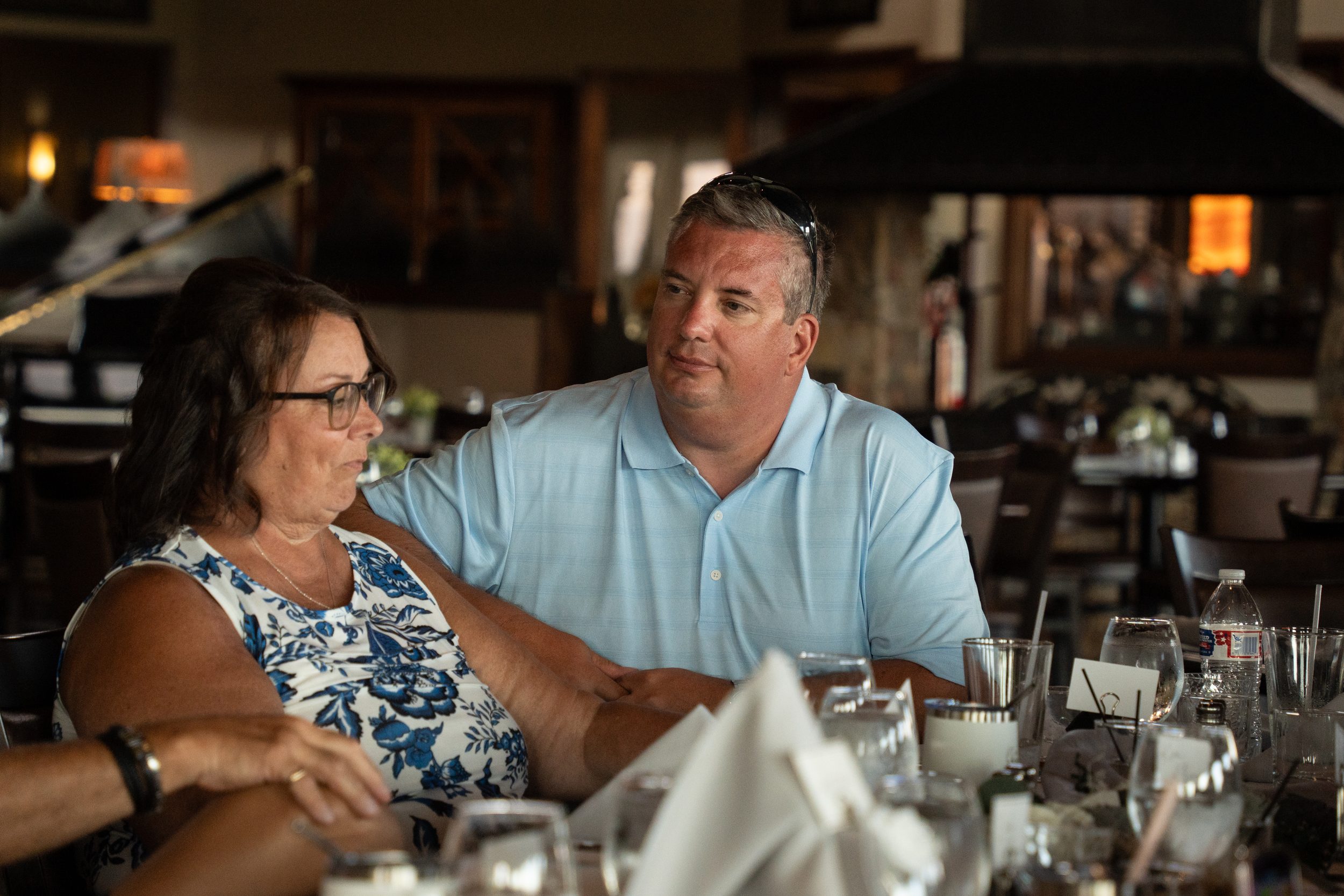 Kim's parents sharing a quiet moment together at the reception dinner table.