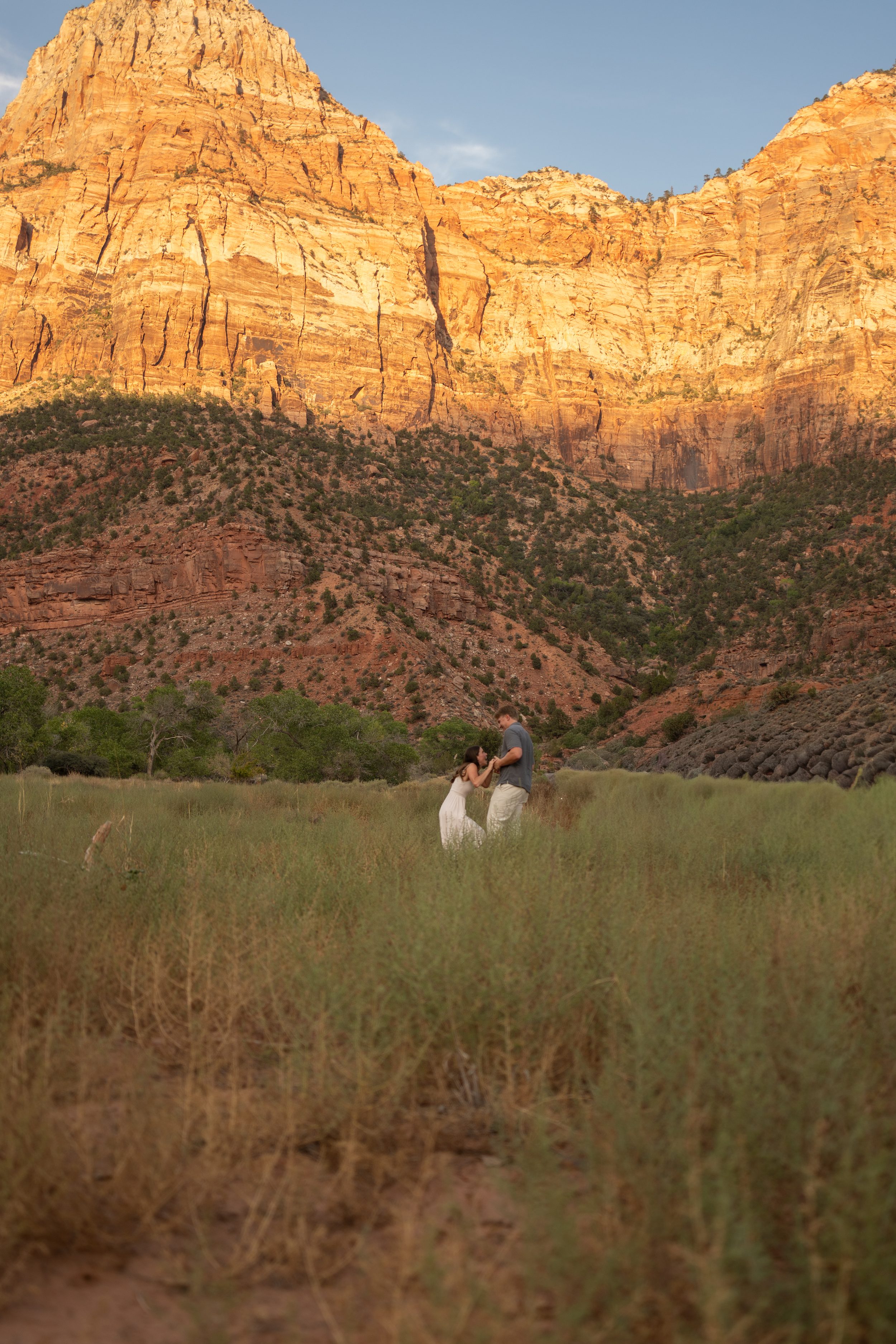Jack and Lyndsey holding hands and examining the ring together moments after the proposal.