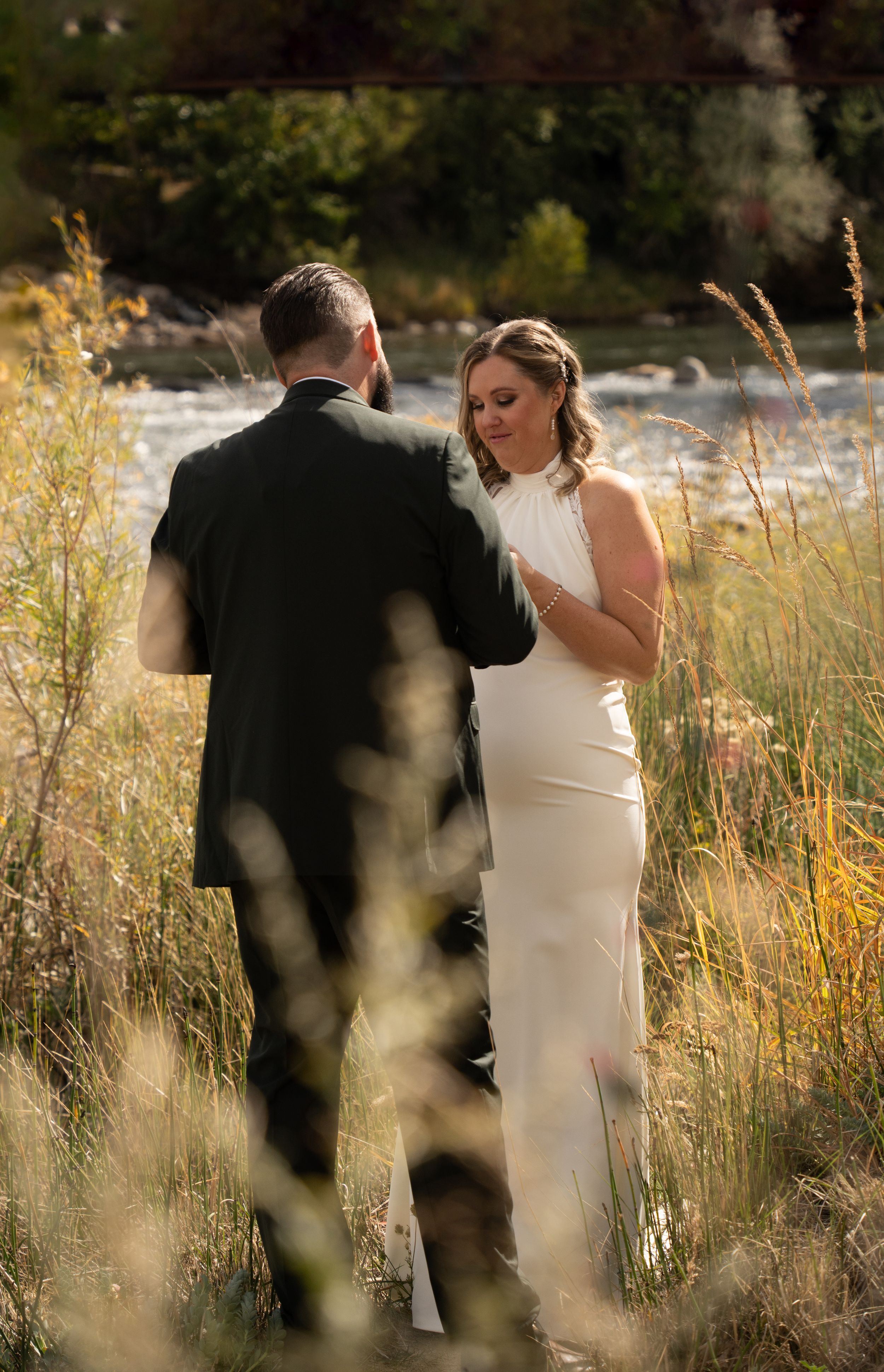 Couple exchanging riverside vows during an elopement ceremony in Saint George, Utah