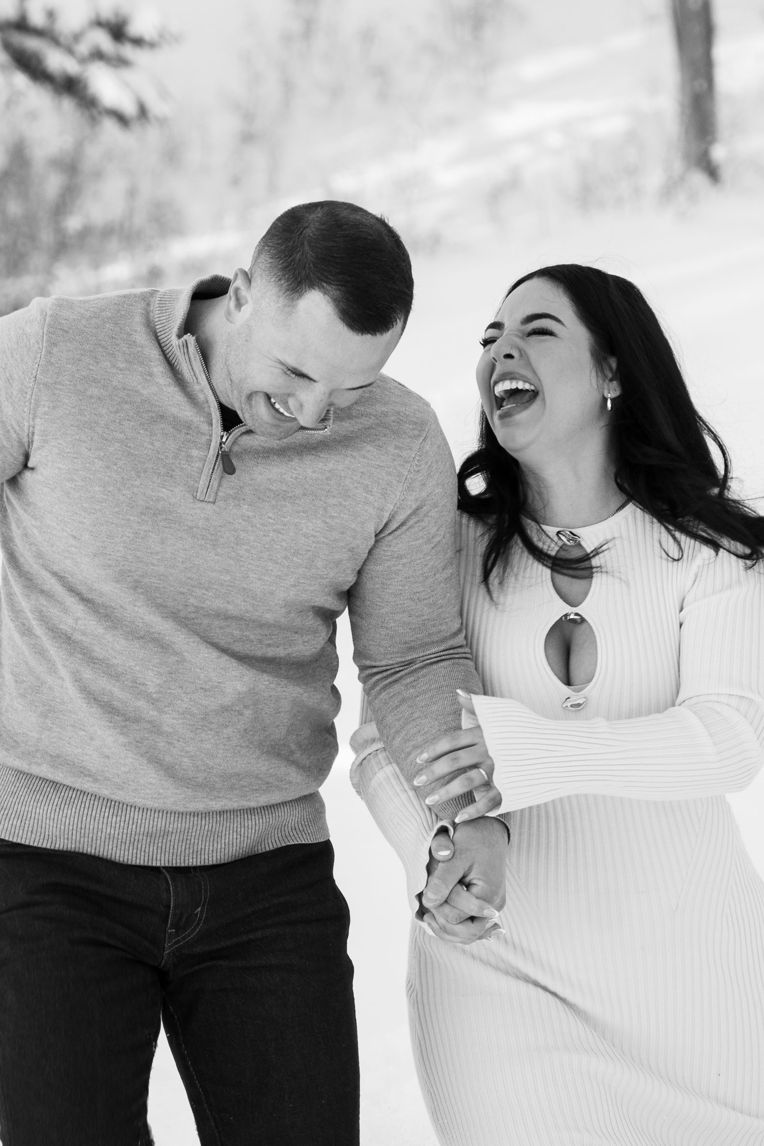 newly married couple laughing after their snowy elopement ceremony in Salt Lake Utah