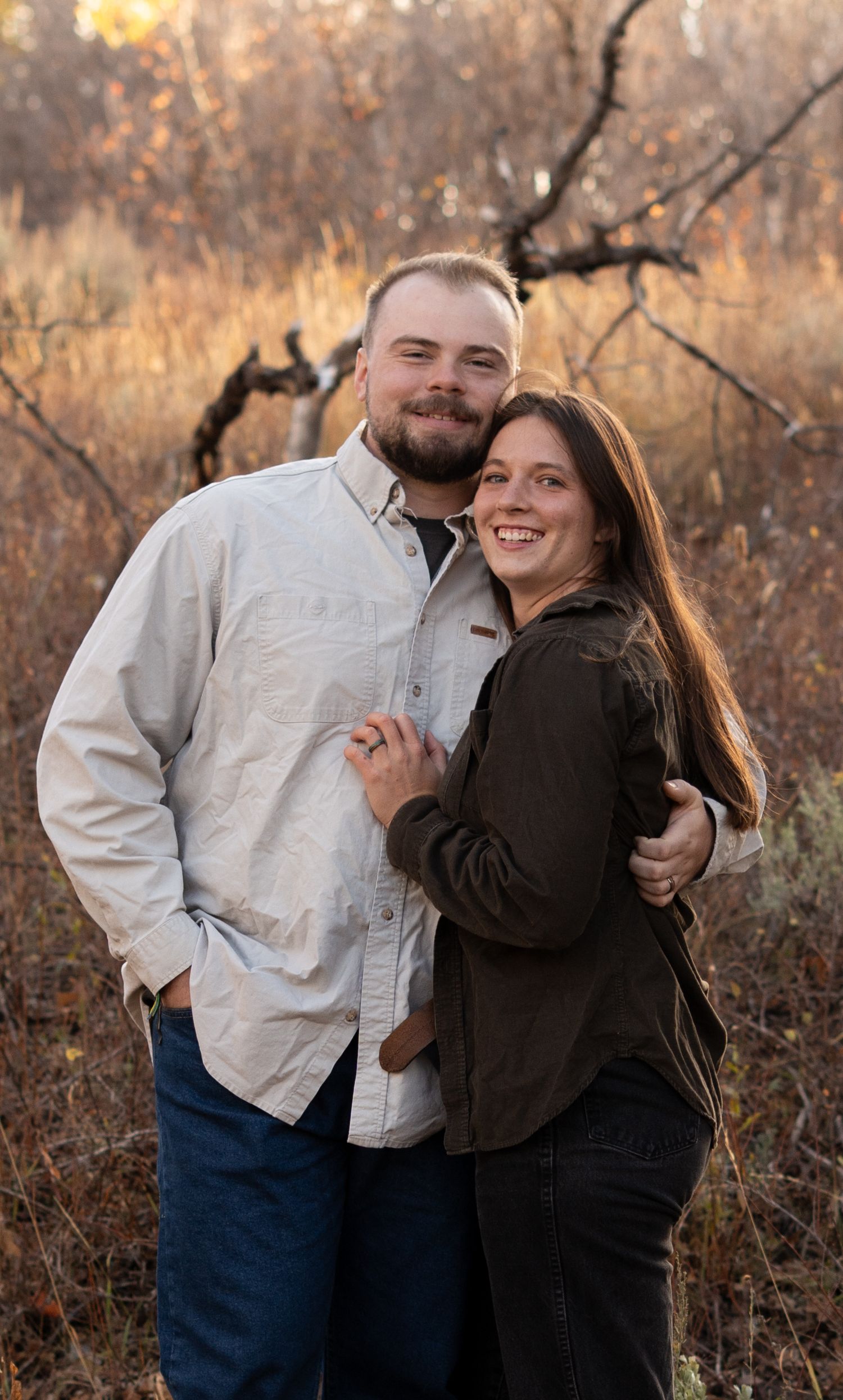 Woman and her husband smiling and hugging