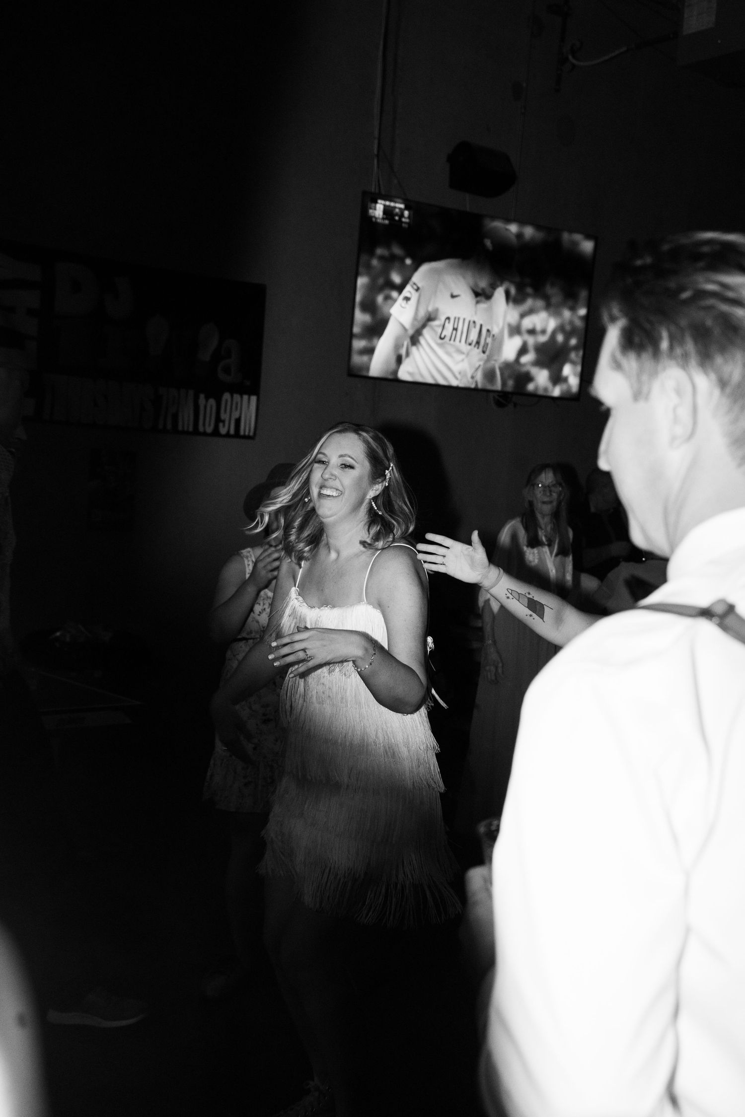 A black and white sequence of dance floor moments showing a bride enjoying herself at a utah wedding reception